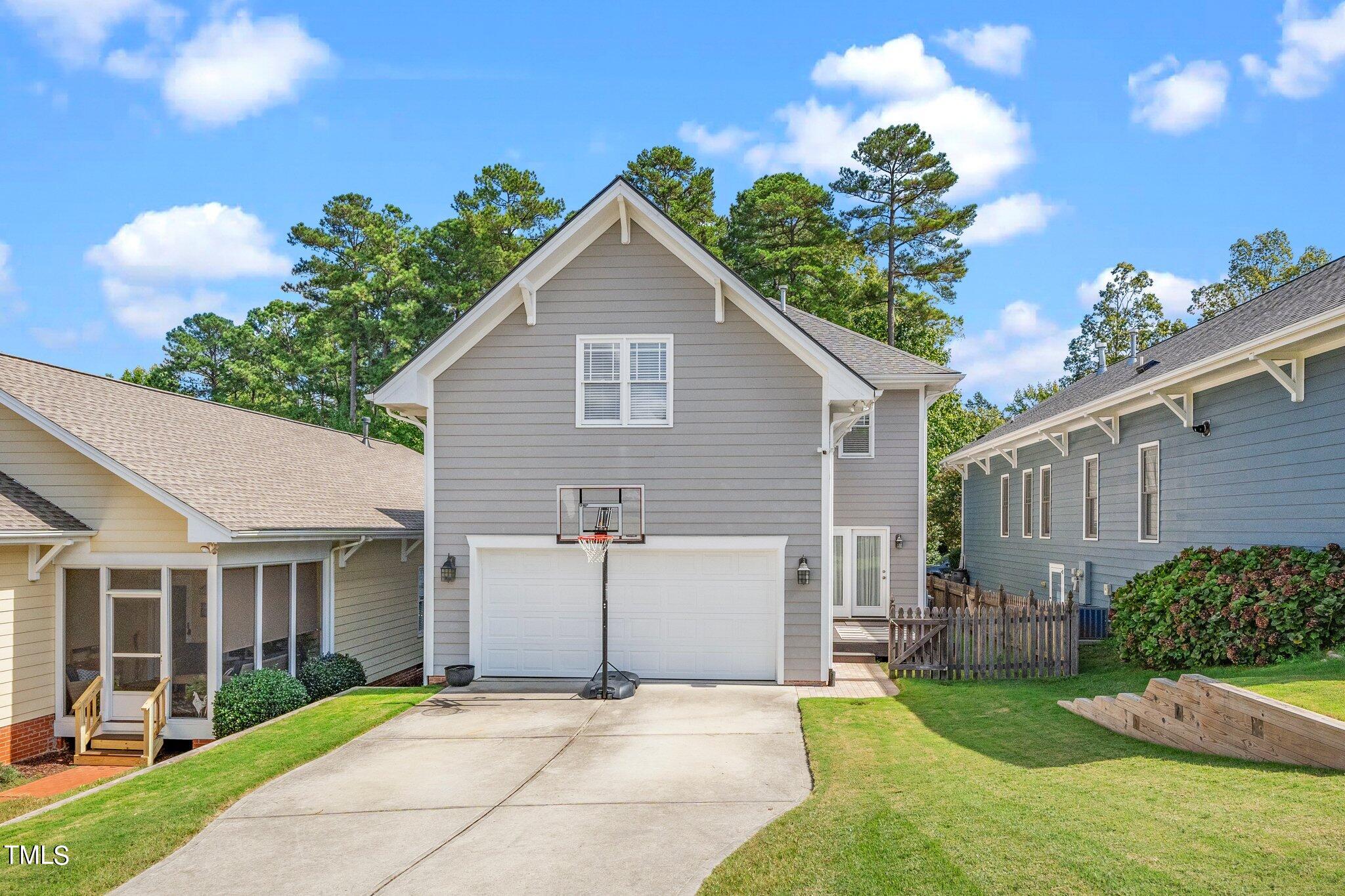 222 Homegate Circle Apex, NC 27502 - Photo 26 of 33 a view of a house with a yard and potted plants