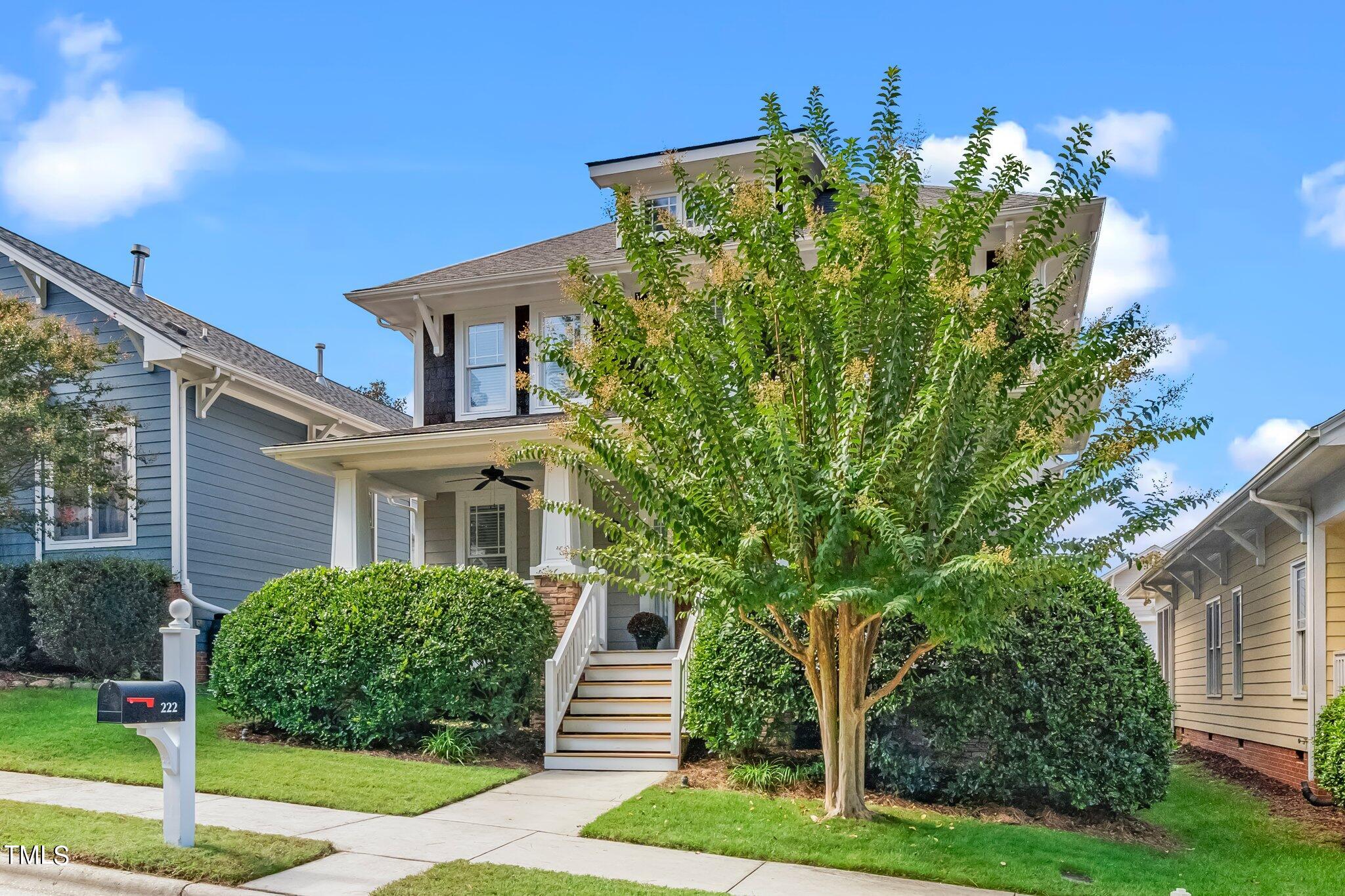 222 Homegate Circle Apex, NC 27502 - Photo 3 of 33 a front view of a house with a yard
