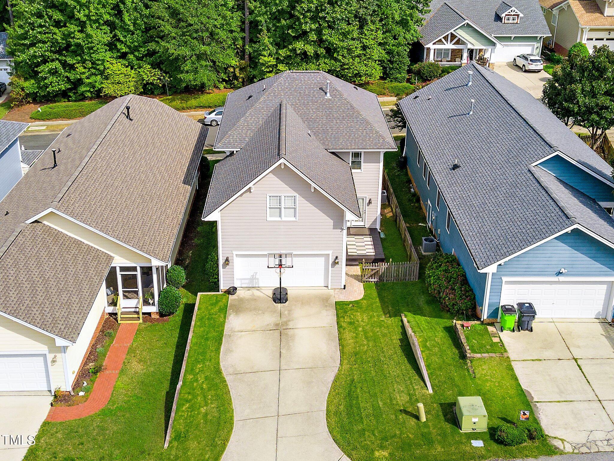 222 Homegate Circle Apex, NC 27502 - Photo 32 of 33 an aerial view of a house with a garden and plants