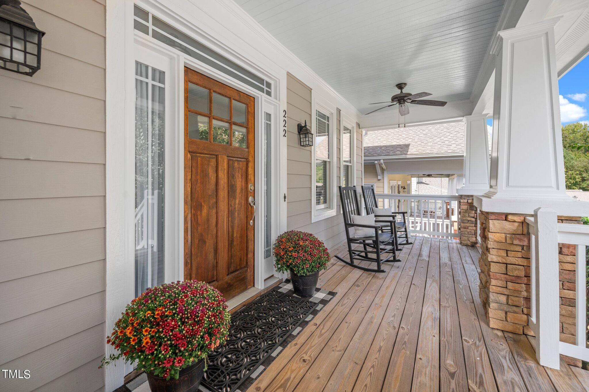 222 Homegate Circle Apex, NC 27502 - Photo 4 of 33 a room with wooden floor and large windows