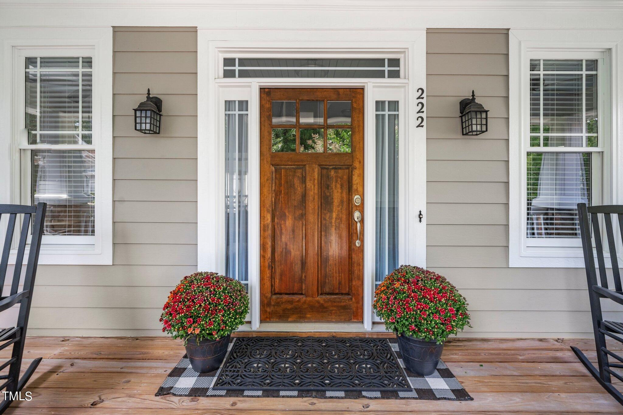 222 Homegate Circle Apex, NC 27502 - Photo 5 of 33 a view of a door and chair and door