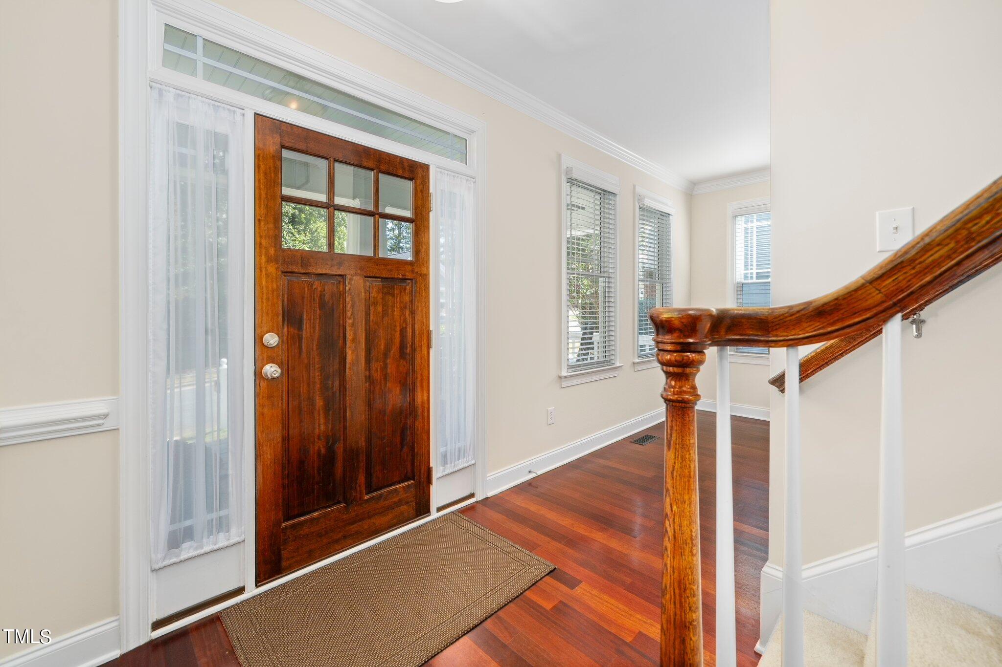 222 Homegate Circle Apex, NC 27502 - Photo 6 of 33 a backyard of a house with wooden floor and stairs
