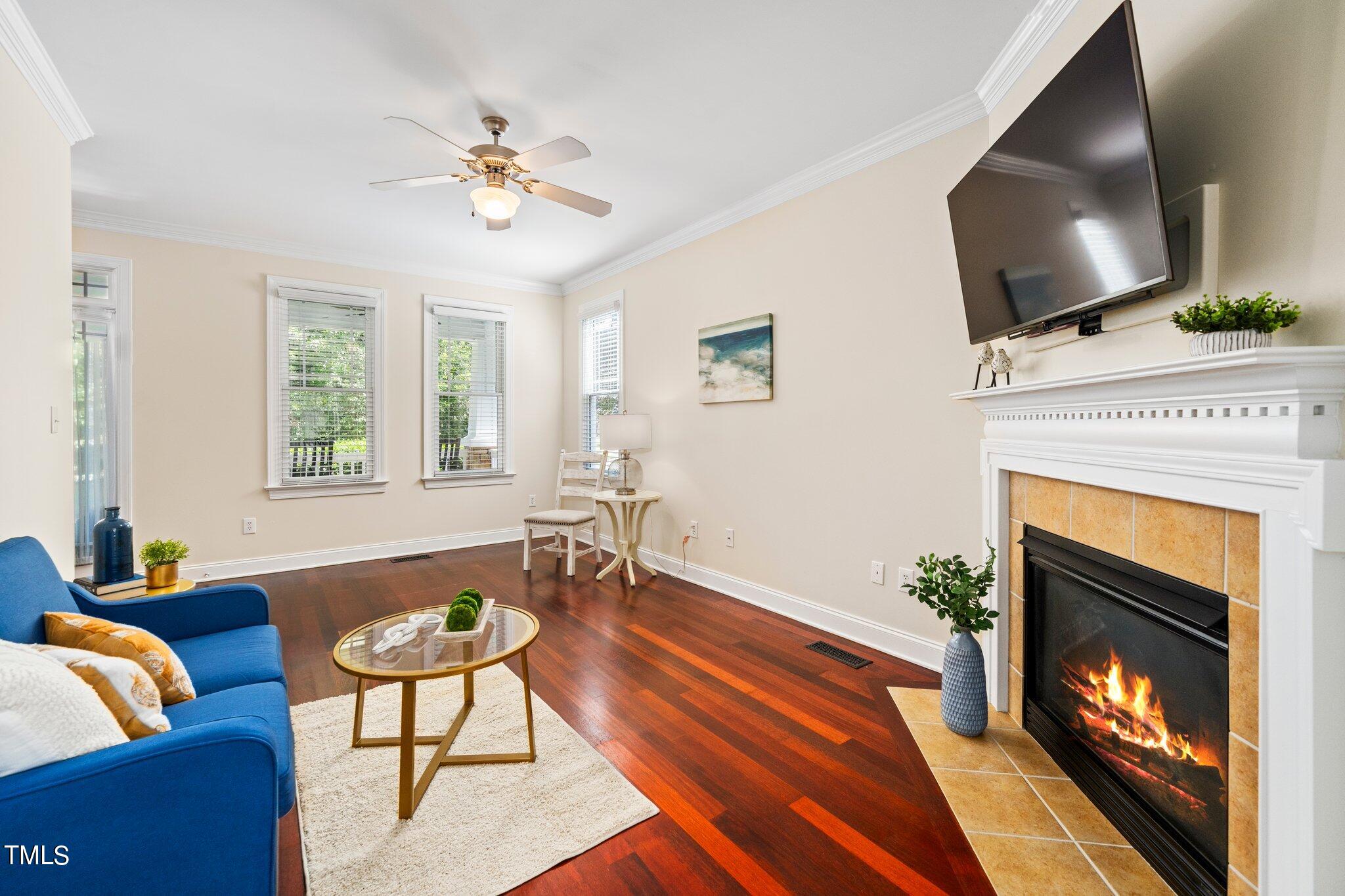 222 Homegate Circle Apex, NC 27502 - Photo 7 of 33 a living room with furniture and a fireplace