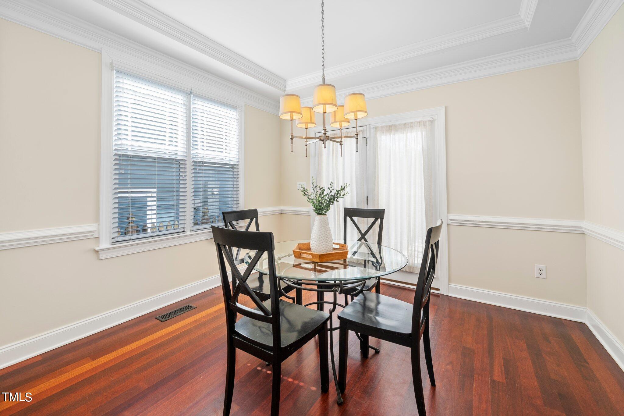 222 Homegate Circle Apex, NC 27502 - Photo 10 of 33 a dining room with furniture and window