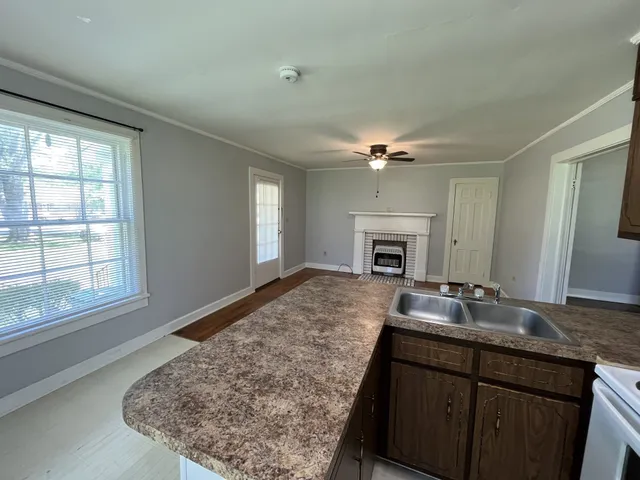 a living room with fireplace furniture and a flat screen tv