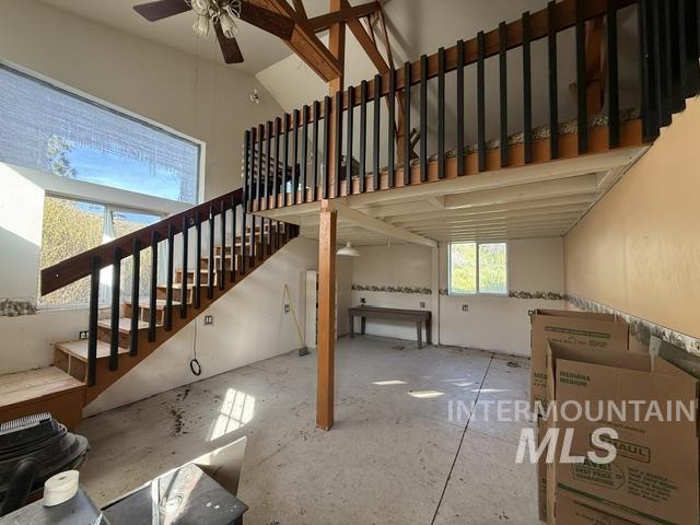 140 Brownlee Loop Road Horseshoe Bend, ID 83629 - Photo 10 of 29 Two-story interior with exposed wood beams and an open loft