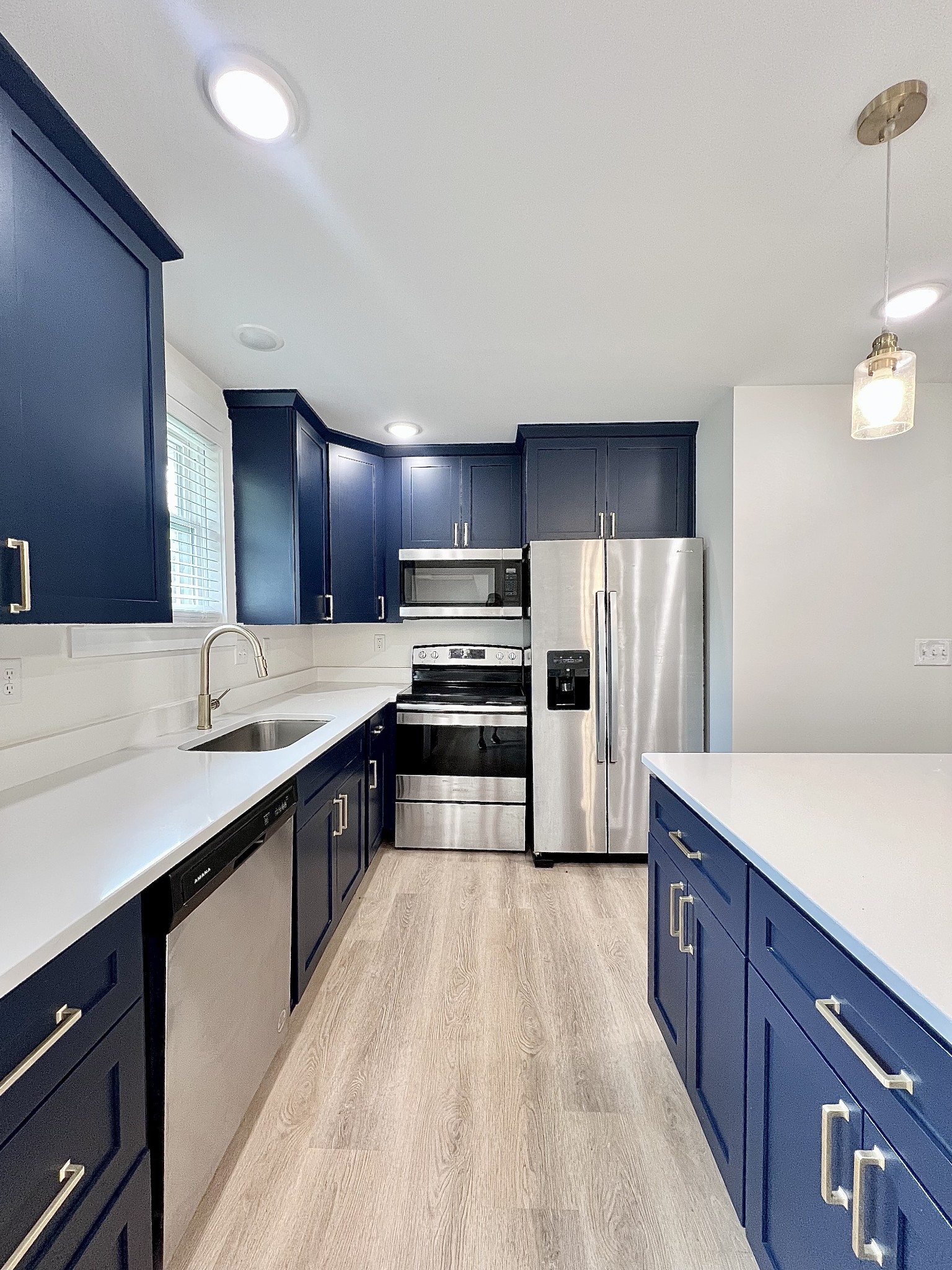 207 North Cedar Lane Pulaski, TN 38478 - Photo 12 of 66 a large kitchen with a large counter top stainless steel appliances and cabinets
