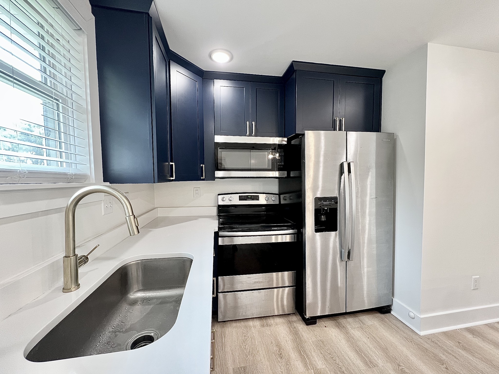 207 North Cedar Lane Pulaski, TN 38478 - Photo 14 of 66 a kitchen with stainless steel appliances granite countertop a refrigerator and a sink