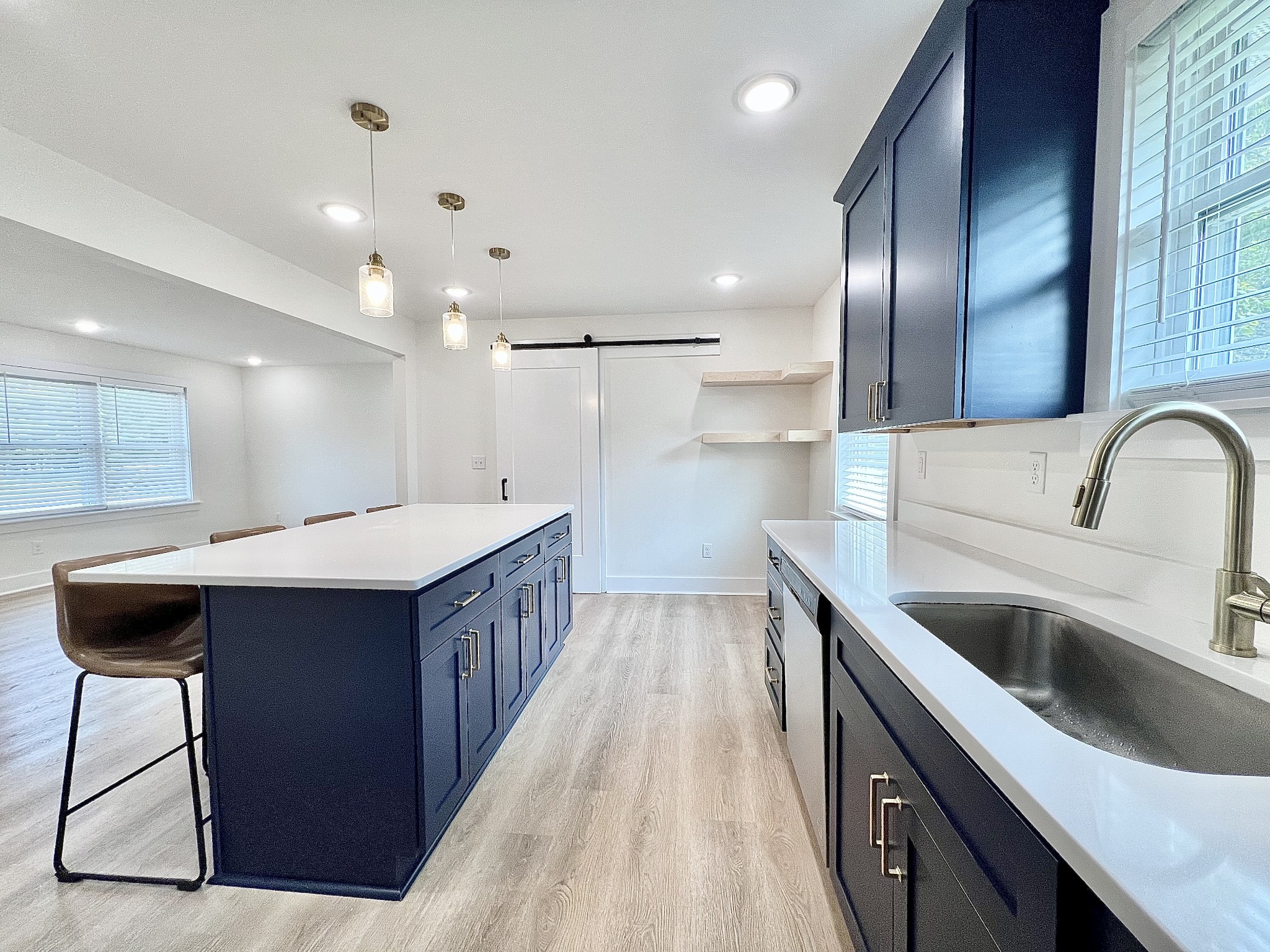 207 North Cedar Lane Pulaski, TN 38478 - Photo 19 of 66 a kitchen with kitchen island granite countertop a sink and wooden cabinets