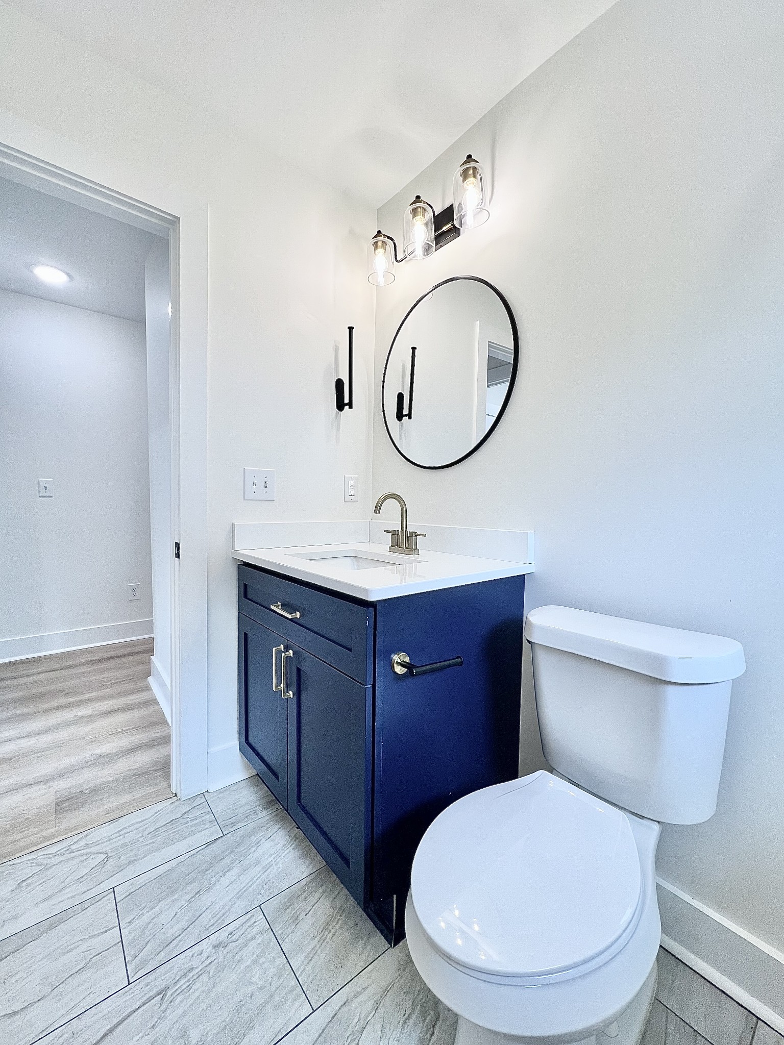 207 North Cedar Lane Pulaski, TN 38478 - Photo 37 of 66 a bathroom with a toilet a sink and a mirror