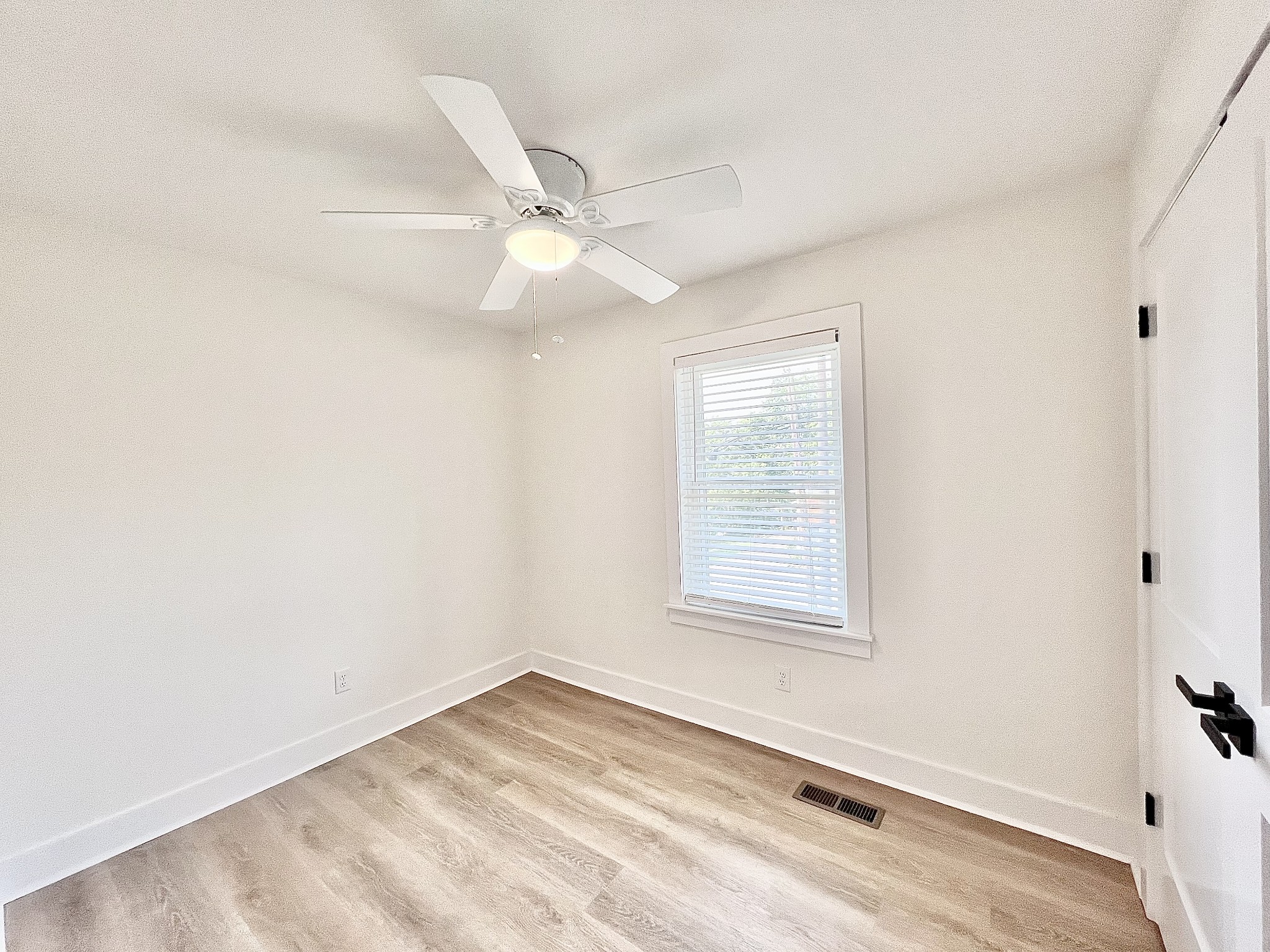 207 North Cedar Lane Pulaski, TN 38478 - Photo 45 of 66 an empty room with a window and ceiling fan