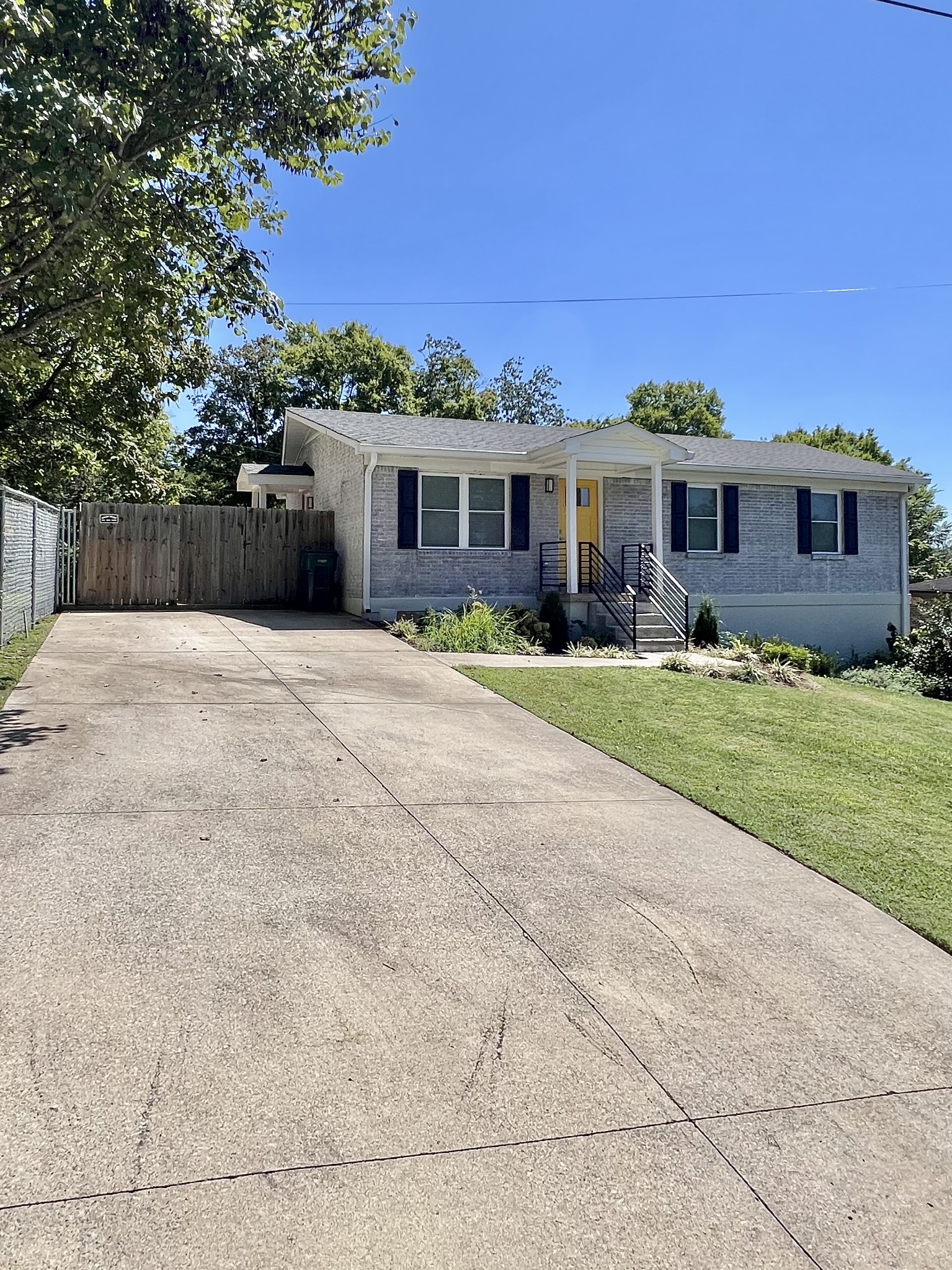 207 North Cedar Lane Pulaski, TN 38478 - Photo 64 of 66 a front view of a house with a yard and trees