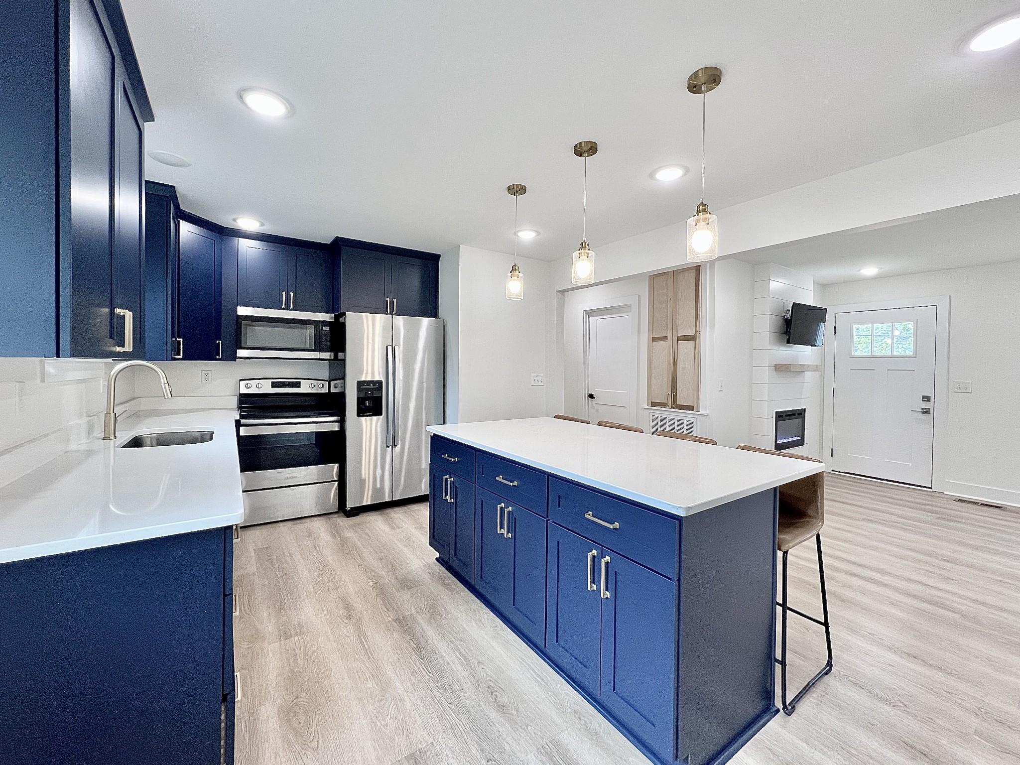 207 North Cedar Lane Pulaski, TN 38478 - Photo 10 of 66 a kitchen with kitchen island granite countertop wooden cabinets and refrigerator