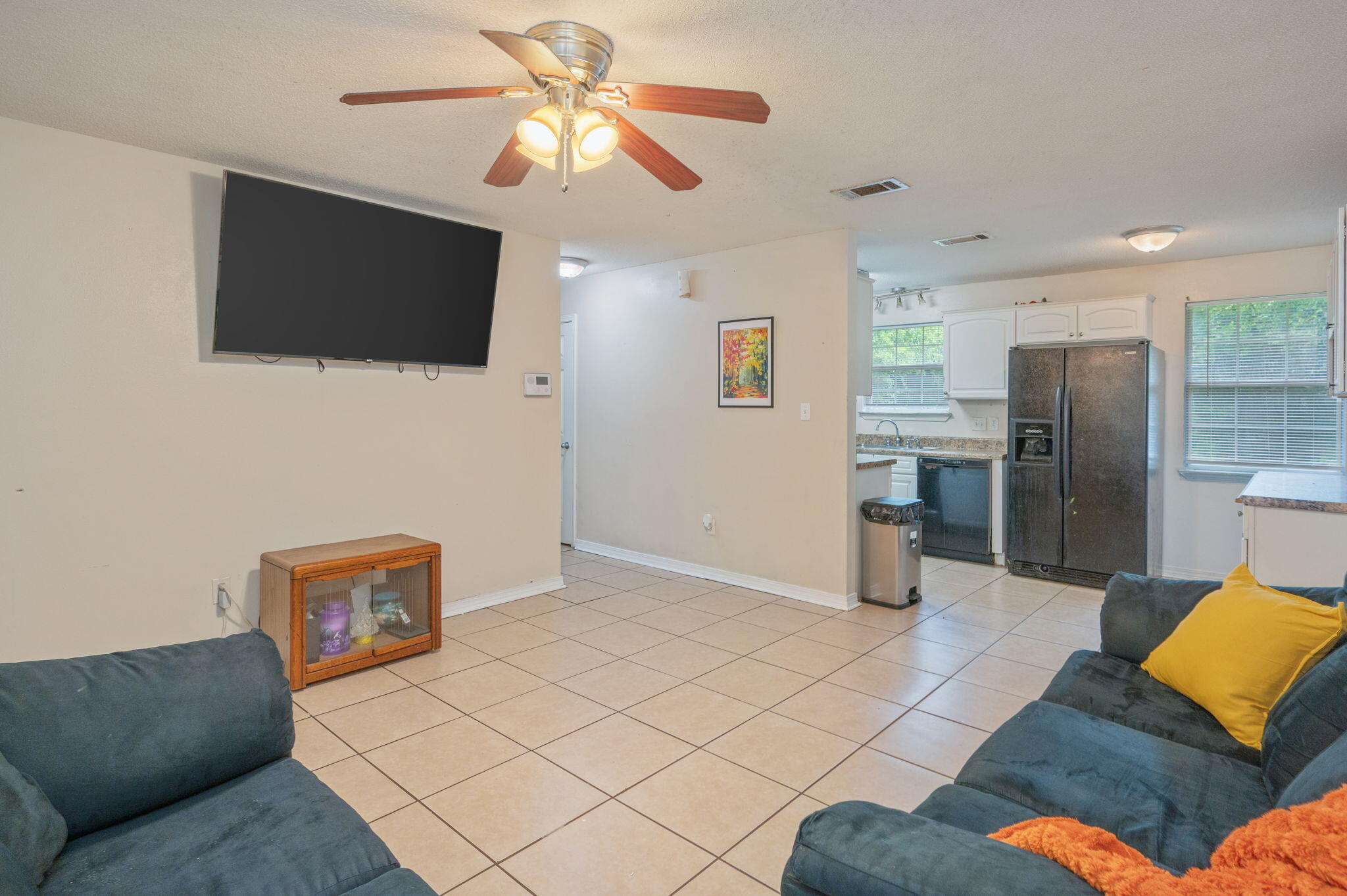 834 McDonald Street Crestview, FL 32536 - Photo 3 of 35 a living room with furniture and a flat screen tv