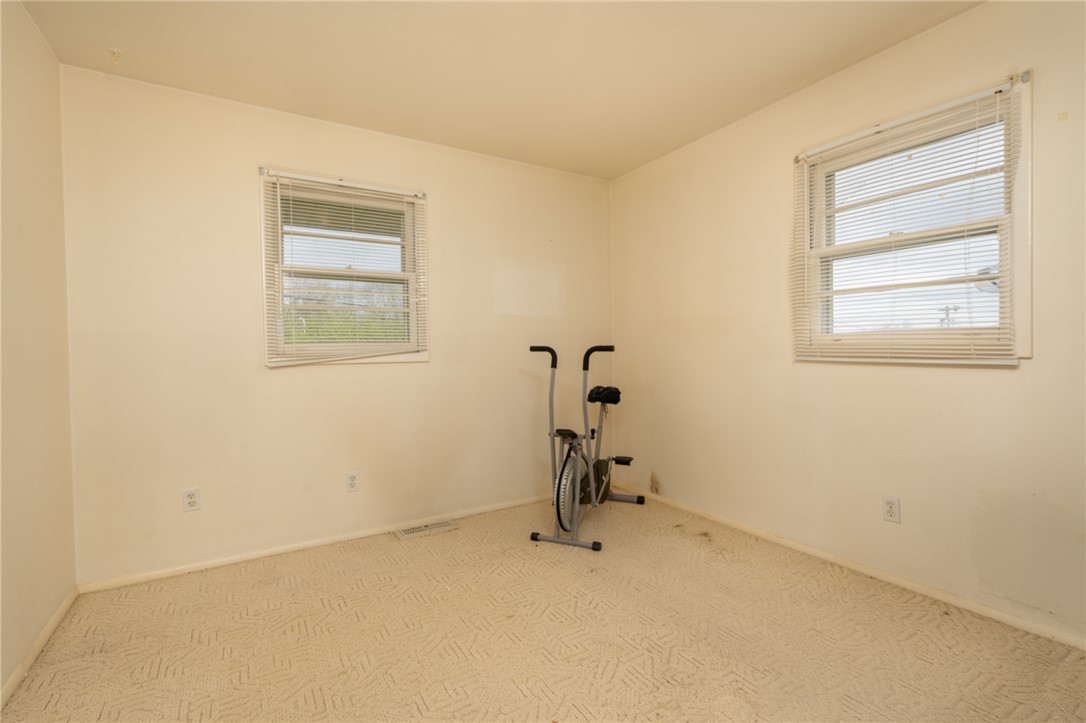 795 Spring Garden Place Dayton, OH 45431 - Photo 25 of 34 This versatile room offers ample space, bathed in natural light, perfect for a home gym or private office.
