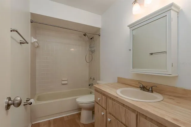 a bathroom with a sink and vanity