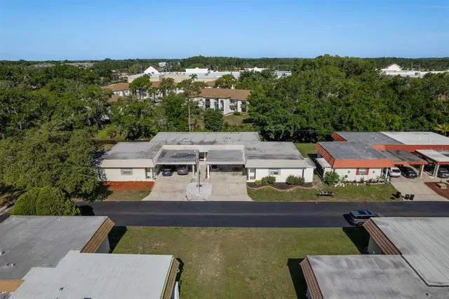 an aerial view of a house with a ocean view