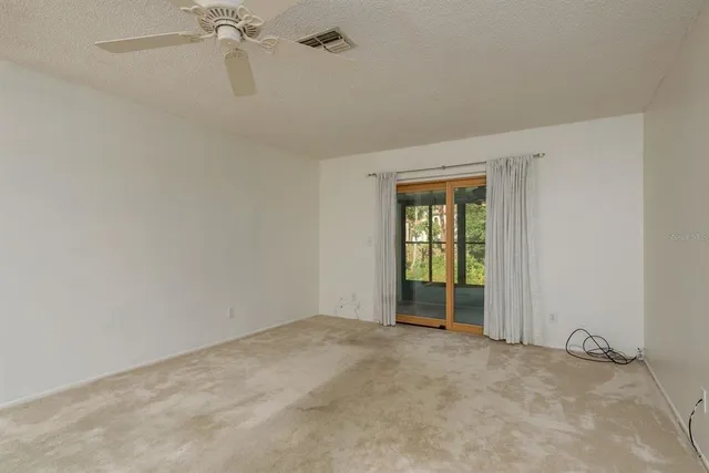 wooden floor and window in an empty room