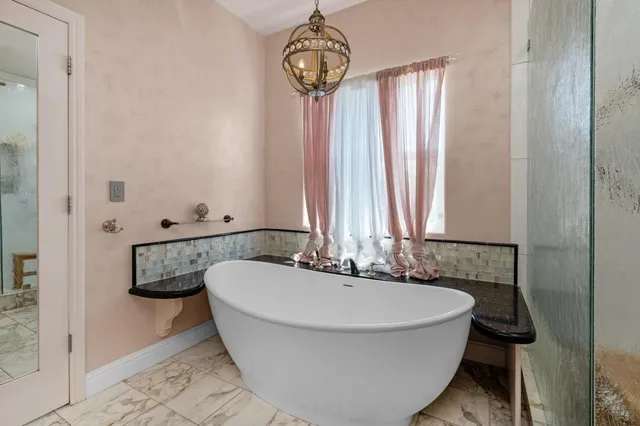 a view of a swimming pool with a patio