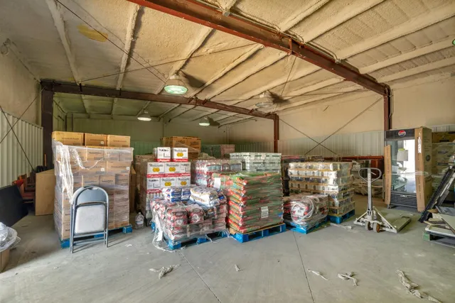 an aerial view of a house with a garden and a yard