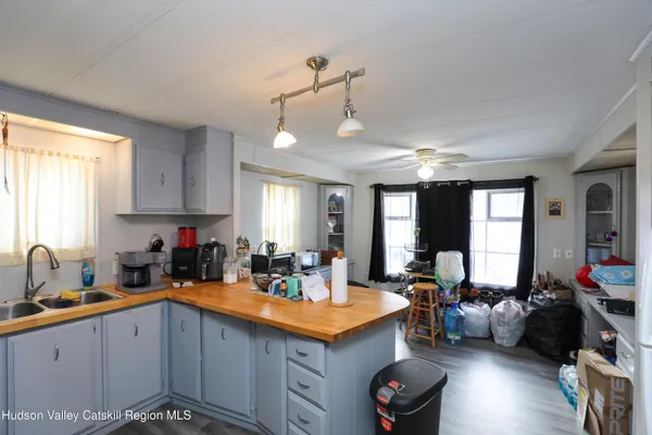 a kitchen with stainless steel appliances granite countertop a sink counter space cabinets and a window