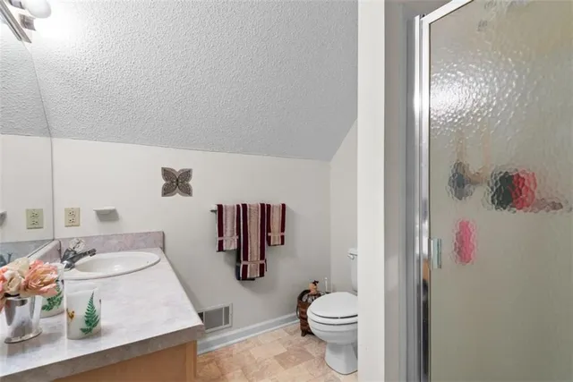 a living room with furniture and a ceiling fan