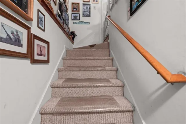 a view of a house with a yard and garage