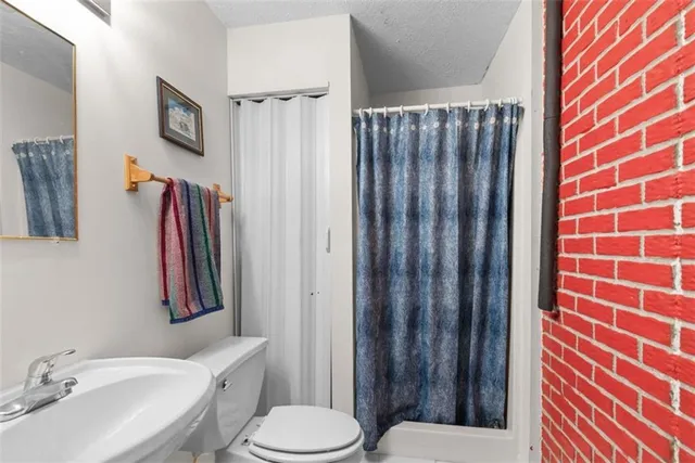 a view of a garage with rack and bicycle