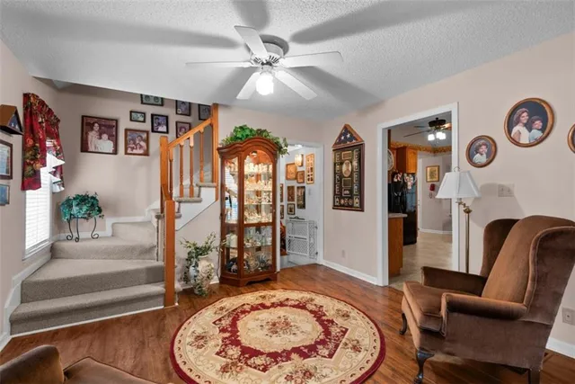 a living room with furniture windows and wooden floor