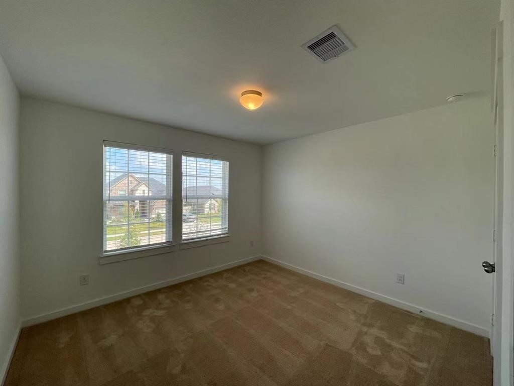 815 Summer Village Way Rosenberg, TX 77469 - Photo 16 of 21 an empty room with a window