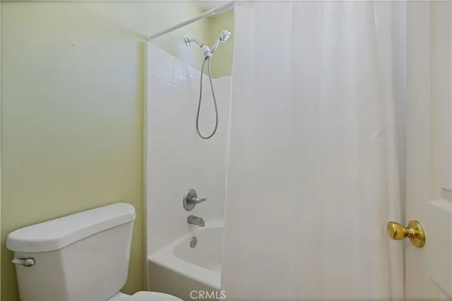 a view of a kitchen with a stove and cabinets