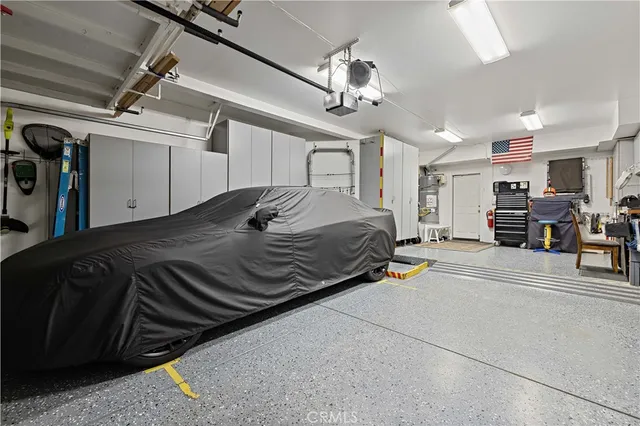 a view of a house with a yard patio and fire pit