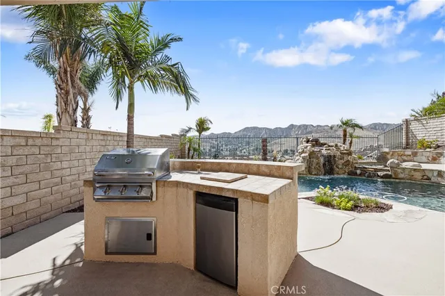 a view of a swimming pool with a patio