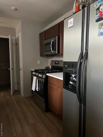 a bedroom with a bed and a lamp