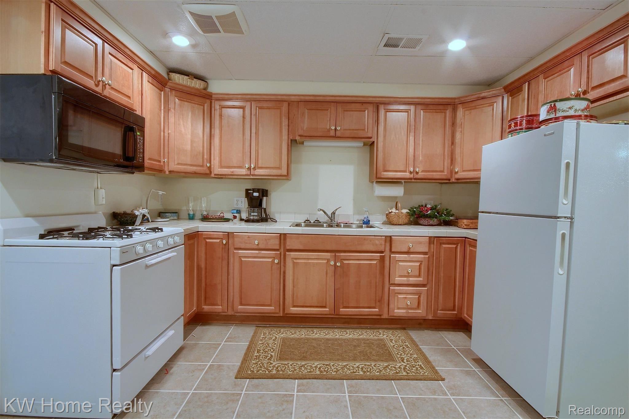 22441 Timber Ridge Court Trenton, MI 48183 - Photo 24 of 29 24-Finished Lower Level Kitchen.jpg
