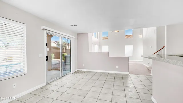 a kitchen with stainless steel appliances granite countertop a sink and a stove