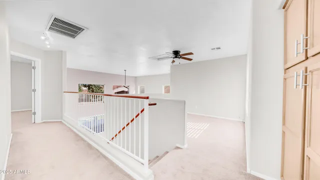 a view of a livingroom with wooden floor and a window