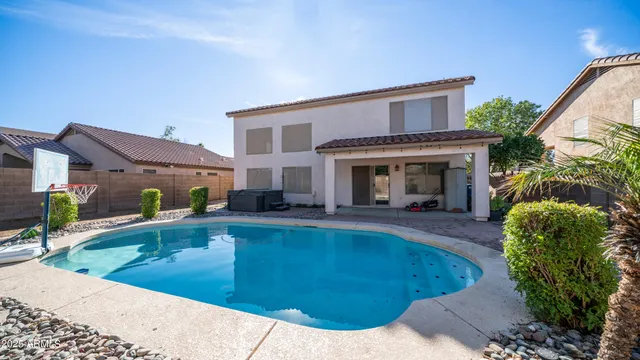 a view of a swimming pool with a chair