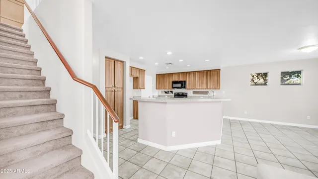 a view of kitchen with furniture and wooden floor
