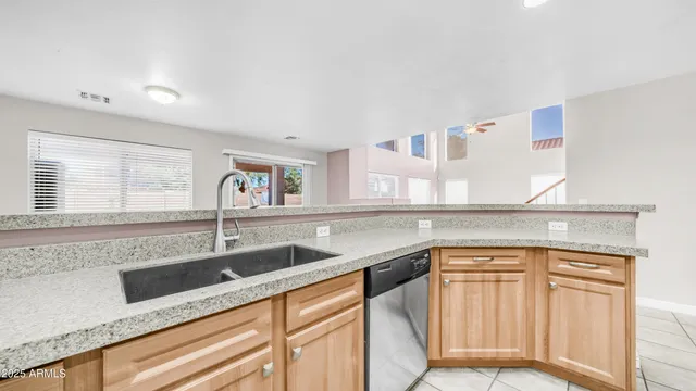 a kitchen with granite countertop a sink and a granite counter tops