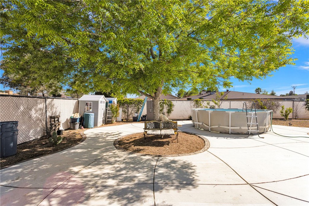 19985 Red Feather Road Apple Valley, CA 92307 - Photo 45 of 56 a view of a house with backyard and sitting area