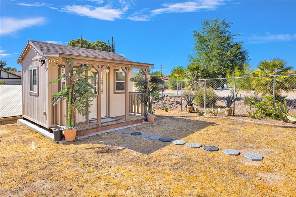 19985 Red Feather Road Apple Valley, CA 92307 - Photo 47 of 56 a view of a building with backyard