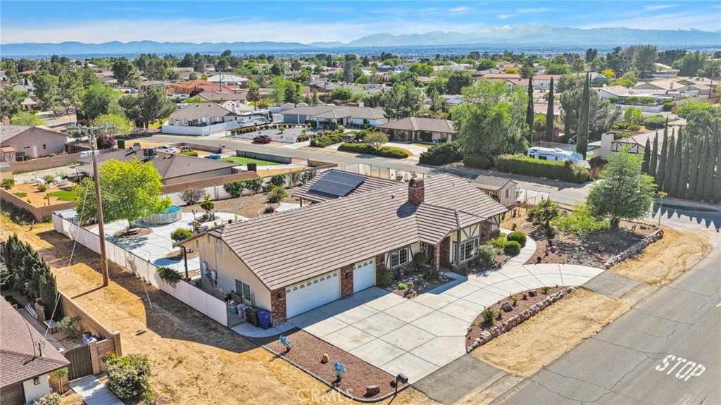 19985 Red Feather Road Apple Valley, CA 92307 - Photo 50 of 56 a view of a terrace with wooden floor and a mountain view