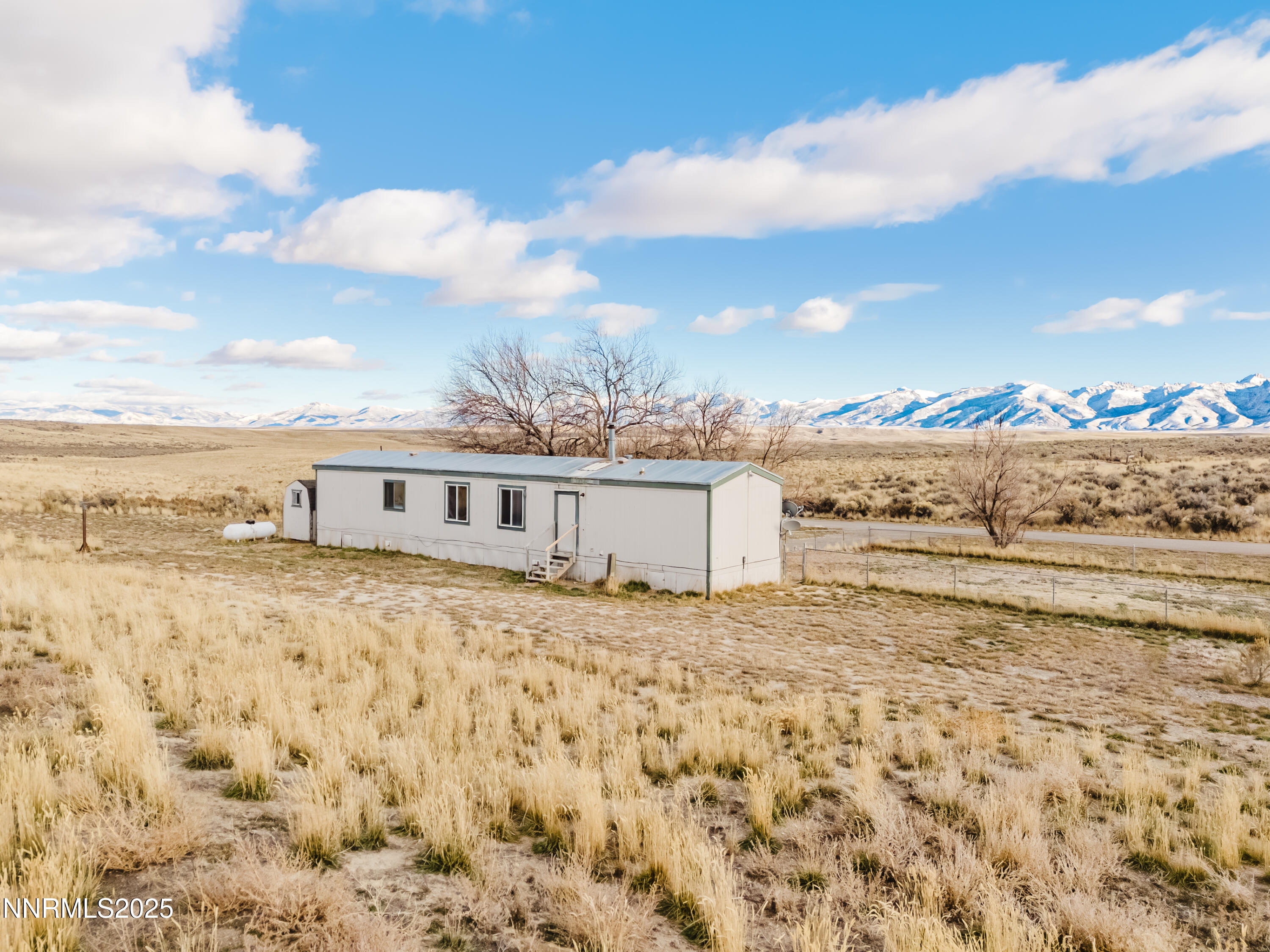 305 Kimble Drive Spring Creek, NV 89815 - Photo 3 of 31 a view of a house with a yard