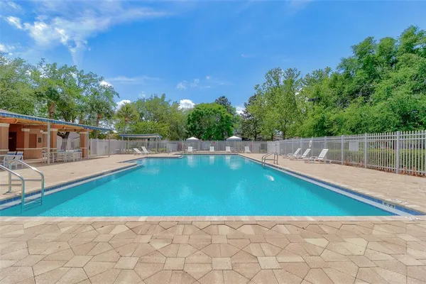 a view of a swimming pool with an outdoor space