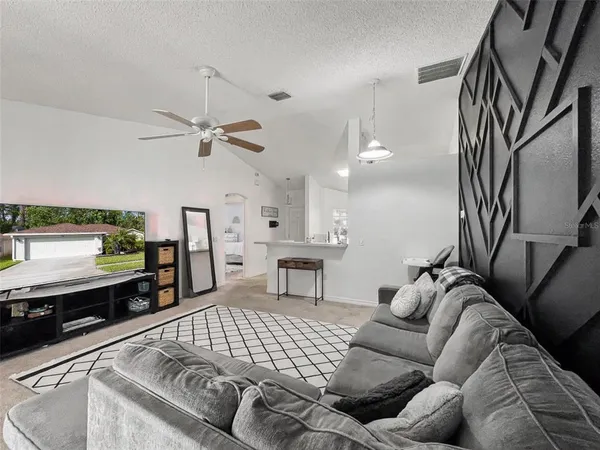 a hallway with mirror and window