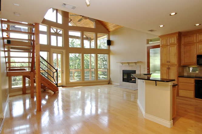 9812 Lake Ridge Drive Austin, TX 78733 - Photo 1 of 1 a view of a living room with kitchen view and a large window