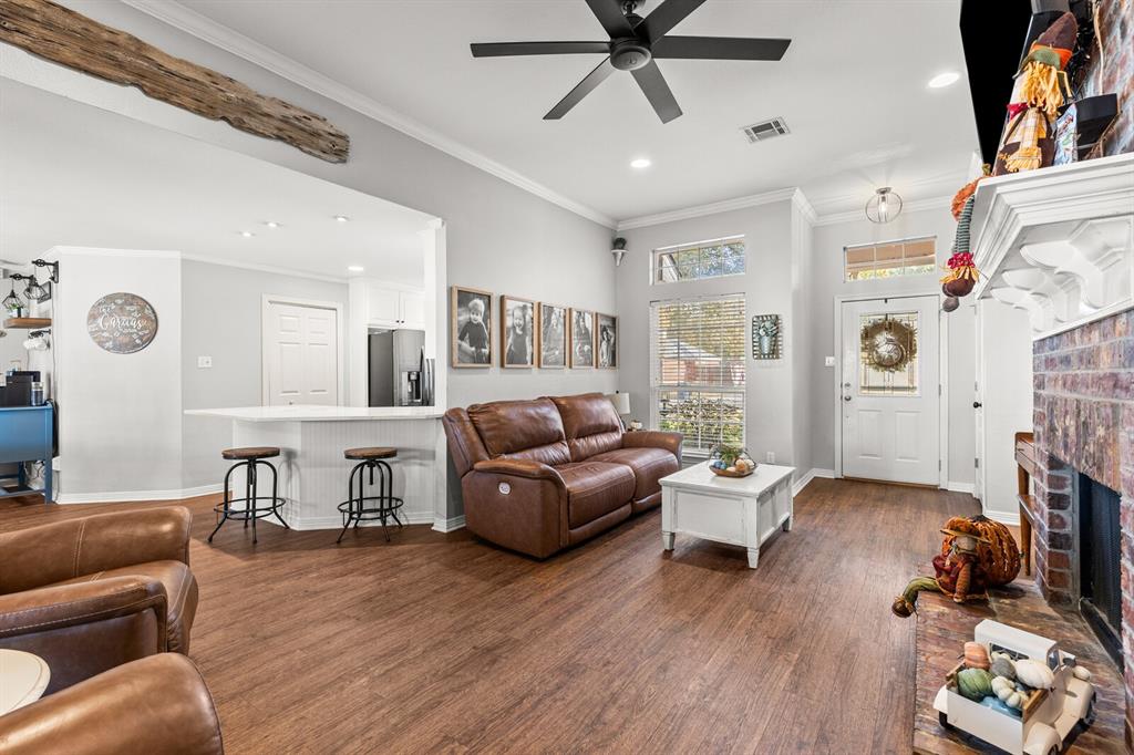 10616 Whitney Trace Drive Waco, TX 76708 - Photo 11 of 37 a living room with furniture and a fireplace
