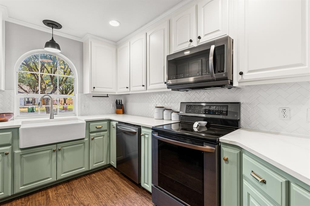 10616 Whitney Trace Drive Waco, TX 76708 - Photo 16 of 37 a kitchen with a sink and a stove top oven