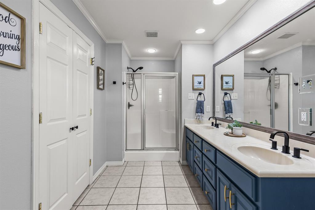 10616 Whitney Trace Drive Waco, TX 76708 - Photo 22 of 37 a bathroom with a double vanity sink mirror and shower